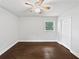 Unstaged bedroom featuring hardwood floors, a ceiling fan, and natural light at 1886 Akron Se Dr, Atlanta, GA 30315