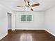 Bedroom features hardwood floors, a window, and a ceiling fan for added comfort at 1886 Akron Se Dr, Atlanta, GA 30315