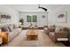 Staged living room featuring ample seating, plush rug, natural light, and neutral color palette at 1886 Akron Se Dr, Atlanta, GA 30315