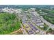 An aerial view showcases this lovely neighborhood with community amenities and green space at 221 Thompson St, Alpharetta, GA 30009