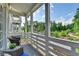 Relaxing balcony with wicker furniture and view of the community park, a lovely outdoor retreat at 221 Thompson St, Alpharetta, GA 30009
