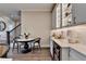 Eat-in dining area features white marble table, bar with wine cooler and decorative glass-front cabinets at 221 Thompson St, Alpharetta, GA 30009