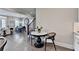 Bright and open eat-in kitchen area adjacent to living room with natural light at 221 Thompson St, Alpharetta, GA 30009
