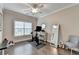 Bright exercise room features hardwood floors, a ceiling fan, and ample natural light from a large window at 221 Thompson St, Alpharetta, GA 30009