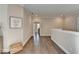 Bright hallway with hardwood floors, neutral paint, and an open feel, creating a welcoming transition space at 221 Thompson St, Alpharetta, GA 30009