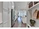 Long open view from kitchen showing island, stainless steel appliances, and French doors to backyard at 221 Thompson St, Alpharetta, GA 30009