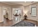 Elegant entryway showcasing an open floor plan, hardwood floors, and a glimpse into the bright, inviting living room at 221 Thompson St, Alpharetta, GA 30009