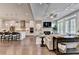 View of the open-concept living room and kitchen layout with lots of natural light at 221 Thompson St, Alpharetta, GA 30009
