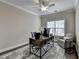 Home office with a large window, a ceiling fan, ample workspace, and an inviting atmosphere for productivity at 221 Thompson St, Alpharetta, GA 30009