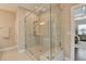 Modern shower with glass enclosure, a bench, and multiple shower heads, providing a spa-like experience at 221 Thompson St, Alpharetta, GA 30009