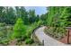 A scenic walking trail meanders through lush greenery, perfect for a stroll at 221 Thompson St, Alpharetta, GA 30009