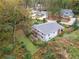 Aerial view of a home with a large backyard and mature trees at 4442 Mclain Cir, Acworth, GA 30101