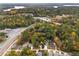 Aerial view of a residential area near a highway and a lake at 4442 Mclain Cir, Acworth, GA 30101