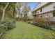 Large backyard area with grass and some trees at 4442 Mclain Cir, Acworth, GA 30101