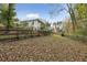Fenced backyard with some mature trees at 4442 Mclain Cir, Acworth, GA 30101