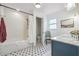 Bright bathroom features a subway tile shower, patterned tile floor, and a vanity with a marble countertop at 4442 Mclain Cir, Acworth, GA 30101