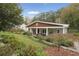 Charming craftsman style home with inviting front porch, beautiful landscaping and mature trees at 4442 Mclain Cir, Acworth, GA 30101