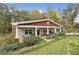 Charming craftsman style home with inviting front porch, beautiful landscaping and mature trees at 4442 Mclain Cir, Acworth, GA 30101