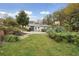 Large front yard with a stone bench and a beautiful lawn at 4442 Mclain Cir, Acworth, GA 30101