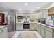 Well-lit kitchen offers stainless steel appliances, ample storage, and sleek countertops for an efficient cooking space at 4442 Mclain Cir, Acworth, GA 30101