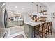 Modern kitchen with stainless steel appliances, marble countertops, a central island and stylish pendant lighting at 4442 Mclain Cir, Acworth, GA 30101
