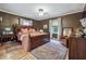 Serene main bedroom features hardwood floors, a king-size bed, and ample natural light, creating a relaxing retreat at 4442 Mclain Cir, Acworth, GA 30101