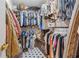 Organized walk-in closet maximizes storage with rods and shelves for clothes, shoes, and accessories at 4442 Mclain Cir, Acworth, GA 30101