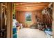 Spacious attic with wooden walls, natural light, and storage areas at 692 Brooks Woolsey Rd, Brooks, GA 30205
