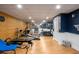 Finished basement transformed into a home gym with exercise equipment and mirrored wall at 692 Brooks Woolsey Rd, Brooks, GA 30205