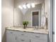 Bright bathroom featuring a marble countertop with double sinks and decorative vanity lighting at 692 Brooks Woolsey Rd, Brooks, GA 30205