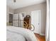 Bedroom featuring a decorative iron bed, hardwood floors, a vintage desk, and natural light at 692 Brooks Woolsey Rd, Brooks, GA 30205