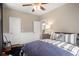 Bedroom with a decorative rug and wainscoting featuring a bed with a striped blanket at 692 Brooks Woolsey Rd, Brooks, GA 30205