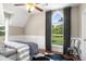 Bedroom with wainscoting featuring a large window with a view to the yard at 692 Brooks Woolsey Rd, Brooks, GA 30205