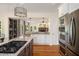 Bright kitchen features stainless appliances, granite countertops, hardwood floors, and open layout at 692 Brooks Woolsey Rd, Brooks, GA 30205