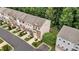 Aerial view of townhomes showcasing well-manicured lawns and a beautiful community at 893 Society Sw Cir, Atlanta, GA 30331