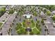 Community aerial of streets lined with homes, a central pool, and a playground area at 893 Society Sw Cir, Atlanta, GA 30331