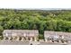 Overview of a townhome community with lush greenery and well-maintained exteriors under a sunny sky at 893 Society Sw Cir, Atlanta, GA 30331