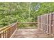 Wooden deck provides outdoor living space overlooking the private, wooded backyard at 893 Society Sw Cir, Atlanta, GA 30331