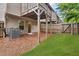 View of backyard showcasing a grassy area with fence, and an AC unit at 893 Society Sw Cir, Atlanta, GA 30331