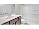 Bathroom featuring shower-tub combo, white toilet and single sink vanity at 893 Society Sw Cir, Atlanta, GA 30331