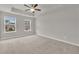 Spacious bedroom with neutral carpet, ceiling fan and great natural light at 893 Society Sw Cir, Atlanta, GA 30331