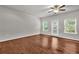 Large bedroom features hardwood floors, ceiling fan and natural lighting at 893 Society Sw Cir, Atlanta, GA 30331