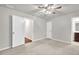 Neutral bedroom with a ceiling fan and plush carpeting, offering a calming retreat at 893 Society Sw Cir, Atlanta, GA 30331