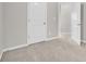 A secondary bedroom showing neutral walls, white trim and carpeted floors at 893 Society Sw Cir, Atlanta, GA 30331
