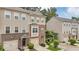 Attractive townhome exterior with varied textures, a welcoming entrance, and well-maintained landscaping at 893 Society Sw Cir, Atlanta, GA 30331