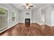 Spacious living room features hardwood floors, a fireplace, and natural light at 893 Society Sw Cir, Atlanta, GA 30331