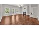 Inviting living room with a fireplace, hardwood floors, and plenty of natural light at 893 Society Sw Cir, Atlanta, GA 30331