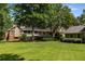 Spacious backyard showcasing a well-maintained lawn and a cozy screened-in porch at 186 Mt Calvary Rd, Marietta, GA 30064