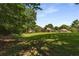 Expansive lawn area with mature trees in the backyard, offering ample space at 186 Mt Calvary Rd, Marietta, GA 30064