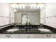 Bathroom features double sinks with dark countertops, neutral walls and an oversized mirror at 186 Mt Calvary Rd, Marietta, GA 30064